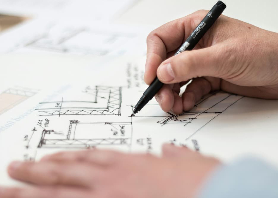 Hand drafting custom house plans for residential design and permit approval